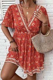 Orange Plus Size Printed Surplice Neck Empire Waist Flowy Mini Dress - Fashion Queen -  1